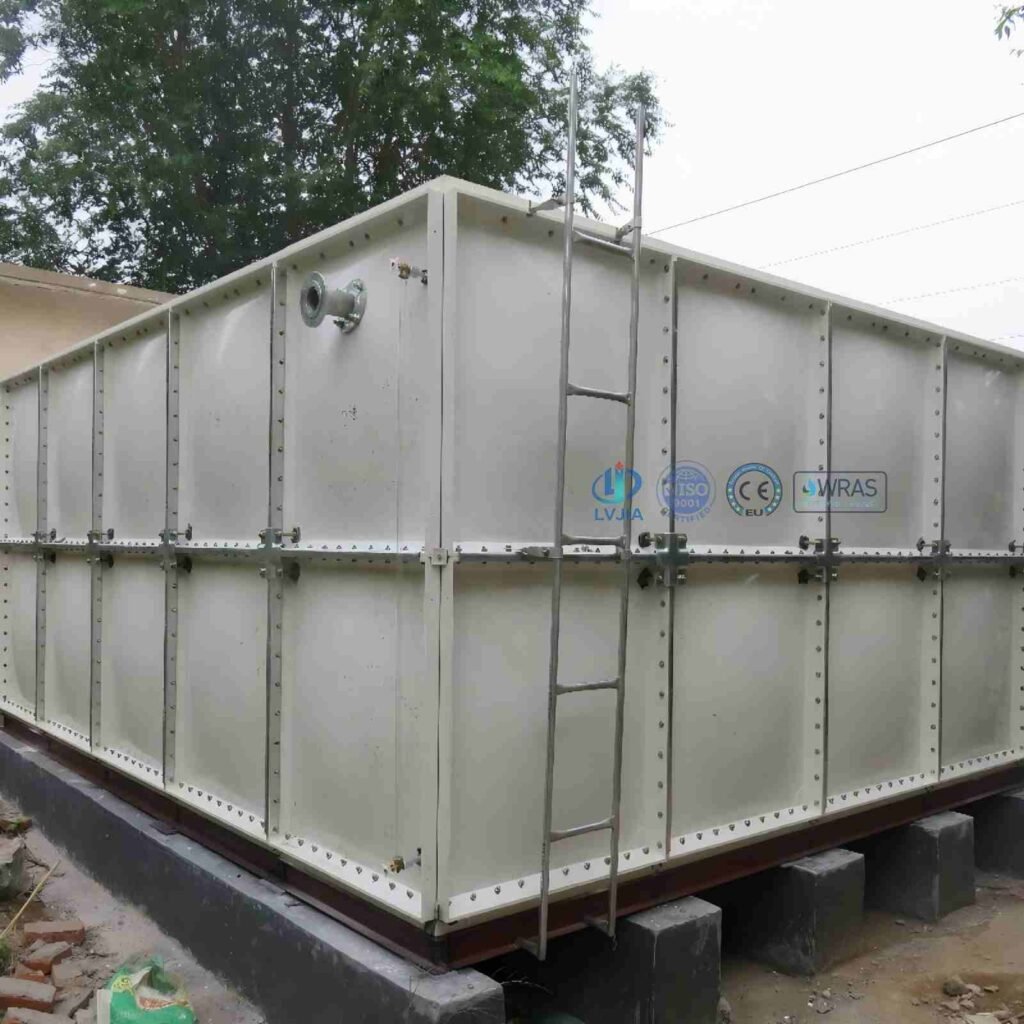 Rooftop GRP water tank panel being carried up a stairwell