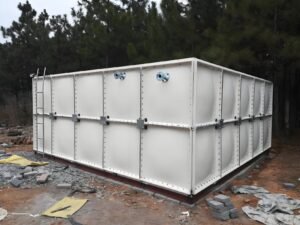 GRP sectional water tank on concrete plinths after assembly