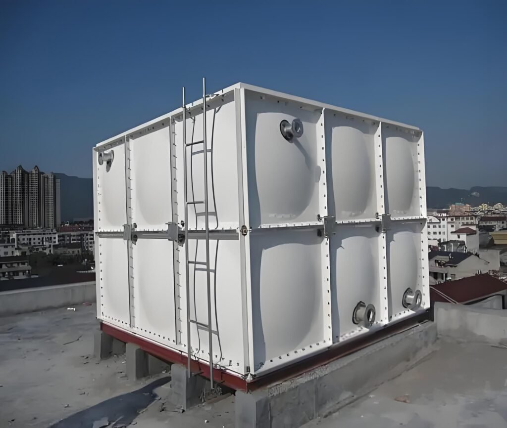 GRP sectional water tank with external ladder on concrete plinths