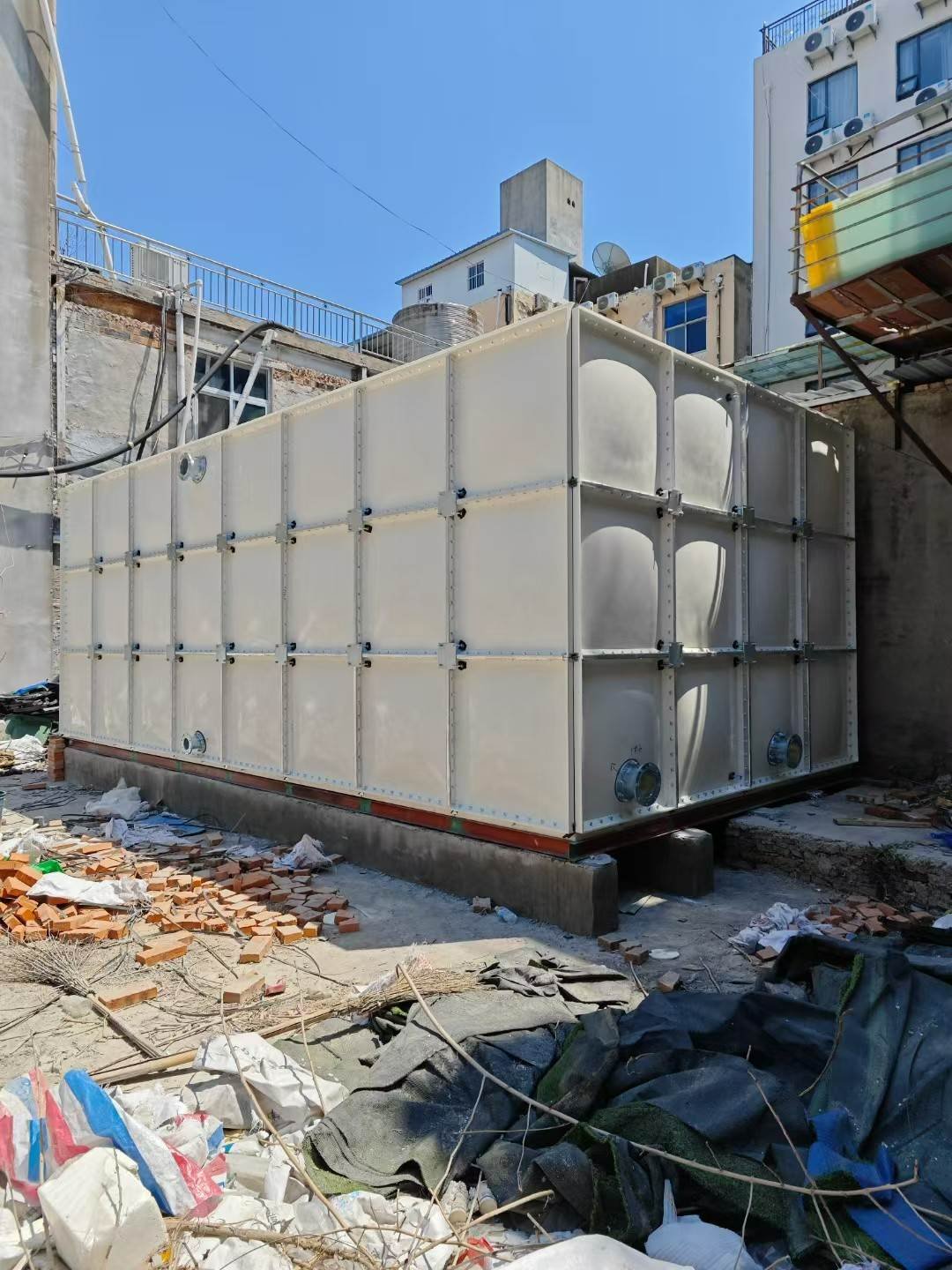 LVJIA GRP sectional water tank installed outdoors on a building site