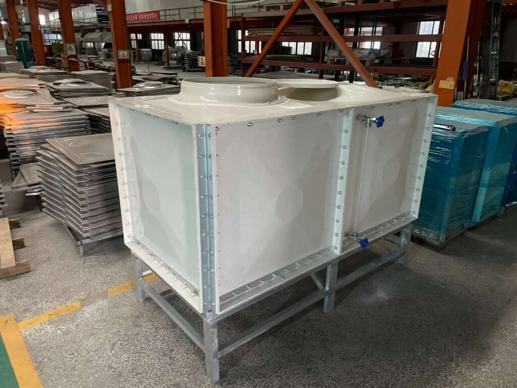 Custom built GRP water tank on a steel stand inside the LVJIA factory