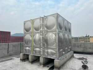 Stainless steel sectional water tank installed inside an industrial plant room